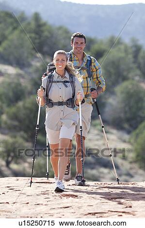 USA, Arizona, Sedona, Young couple hiking in desert View Large Photo Image Stock Photography - USA, Arizona, Sedona, Young couple hiking in desert. Fotosearch