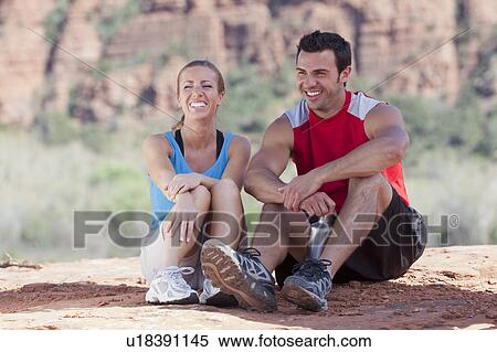 USA, Arizona, Sedona, Young couple enjoying view in desert after hiking View Large Photo Image Stock Photography - USA, Arizona, Sedona, Young couple enjoying view in desert after hiking. Fotosearch