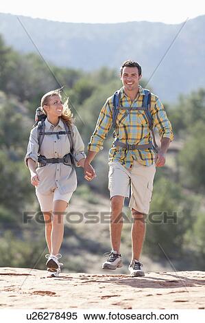 USA, Arizona, Sedona, Young couple hiking in desert View Large Photo Image Stock Photography - USA, Arizona, Sedona, Young couple hiking in desert. Fotosearch