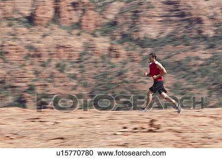 USA, Arizona, Sedona, Young man running in desert View Large Photo Image Stock Image - USA, Arizona, Sedona, Young man running in desert. Fotosearch