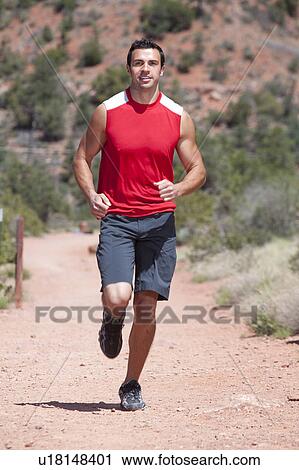 USA, Arizona, Sedona, Young man running in desert View Large Photo Image Stock Image - USA, Arizona, Sedona, Young man running in desert. Fotosearch