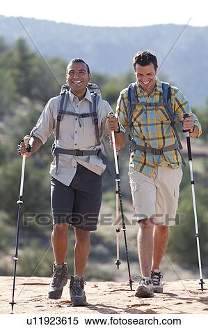 USA, Arizona, Sedona, Young men hiking in desert View Large Photo Image Stock Photography - USA, Arizona, Sedona, Young men hiking in desert. Fotosearch