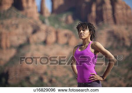 USA, Arizona, Sedona, Young woman standing at desert View Large Photo Image Stock Photograph - USA, Arizona, Sedona, Young woman standing at desert. Fotosearch