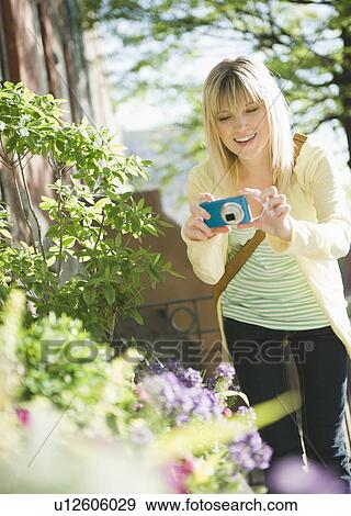 USA, Brooklyn, Williamsburg, Woman photographing flowers View Large Photo Image Stock Photo - USA, Brooklyn, Williamsburg, Woman photographing flowers. Fotosearch