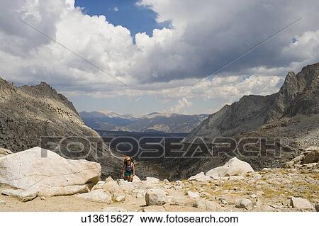 Stock Photo - USA, California, Sequoia National Park, Five Lakes trail, Hiker walking. Fotosearch