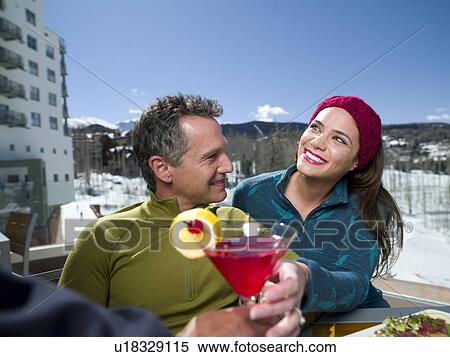 USA, Colorado, Telluride, Couple enjoying outdoor meal at ski resort View Large Photo Image Stock Photography - USA, Colorado, Telluride, Couple enjoying outdoor meal at ski resort. Fotosearch