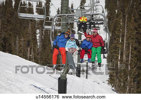 Stock Photograph - USA, Colorado, Telluride, Family on ski lift. Fotosearch