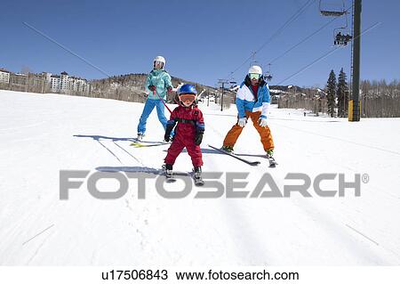 USA, Colorado, Telluride, Family skiing together View Large Photo Image Stock Image - USA, Colorado, Telluride, Family skiing together. Fotosearch