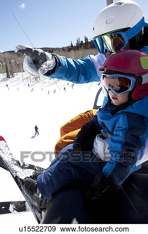 USA, Colorado, Telluride, Father with son (2-3) on ski lift View Large Photo Image Stock Photo - USA, Colorado, Telluride, Father with son (2-3) on ski lift. Fotosearch