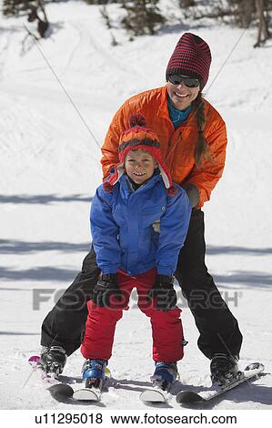 USA, Colorado, Telluride, Mother with son (8-9) skiing together View Large Photo Image Stock Photo - USA, Colorado, Telluride, Mother with son (8-9) skiing together. Fotosearch