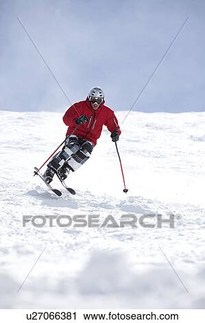Stock Image - USA, Colorado, Telluride, Skier on fresh powder snow. Fotosearch