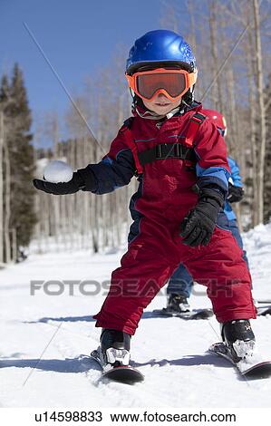 Stock Image - USA, Colorado, Telluride, Two boys (4-5, 2-3) skiing. Fotosearch
