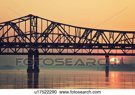 Stock Image - USA, Kentucky, Louisville, Sunrise by Ohio River. Fotosearch