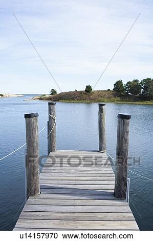 Stock Image - USA, Massachusetts, Pier at lake. Fotosearch
