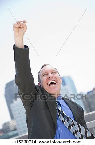 USA, New Jersey, Jersey City, Businessman gesturing with success View Large Photo Image Picture - USA, New Jersey, Jersey City, Businessman gesturing with success. Fotosearch
