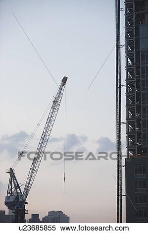 Stock Photography - USA, New York State, New York City, Cranes against sky. Fotosearch