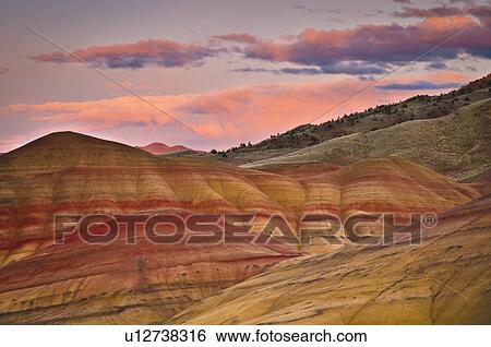 Stock Photograph - USA, Oregon, Mitchell, Painted Hills during sunset. Fotosearch