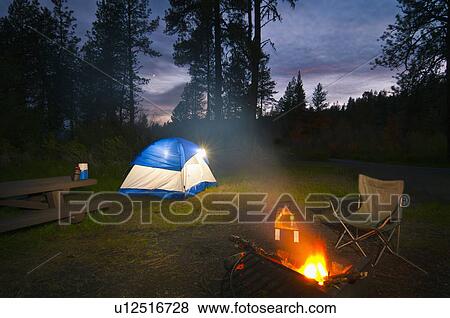 USA, Oregon, Ochoco Mountains, Tent and campfire at dusk View Large Photo Image Stock Photo - USA, Oregon, Ochoco Mountains, Tent and campfire at dusk. Fotosearch