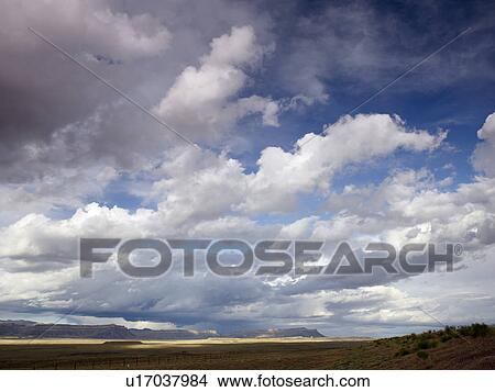 USA, Utah, Clouds over desert landscape View Large Photo Image Picture - USA, Utah, Clouds over desert landscape. Fotosearch
