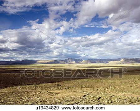Stock Photo - USA, Utah, Clouds over desert landscape. Fotosearch