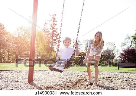 USA, Washington State, Seattle, Mother and son (2-3) swinging on swing in park View Large Photo Image Stock Image - USA, Washington State, Seattle, Mother and son (2-3) swinging on swing in park. Fotosearch