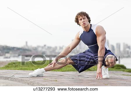 USA, Washington State, Seattle, Young athlete doing workout View Large Photo Image Stock Image - USA, Washington State, Seattle, Young athlete doing workout. Fotosearch