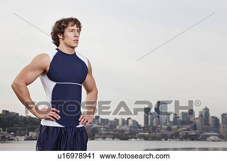 USA, Washington State, Seattle, Young athlete doing workout, skyline in background View Large Photo Image Stock Image - USA, Washington State, Seattle, Young athlete doing workout, skyline in background. Fotosearch