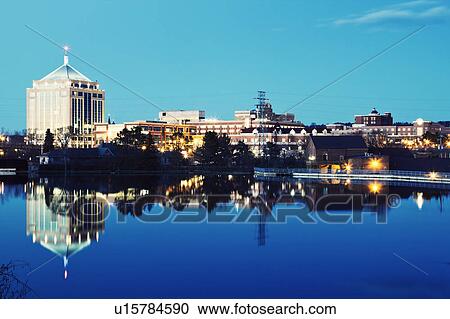 Stock Image - USA, Wisconsin, Wausau, Evening skyline. Fotosearch