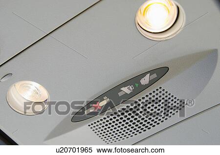 Warning signs in airplane cabin View Large Photo Image Stock Photography - Warning signs in airplane cabin. Fotosearch