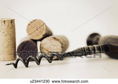 Stock Image - Wine corks with corkscrew. Fotosearch