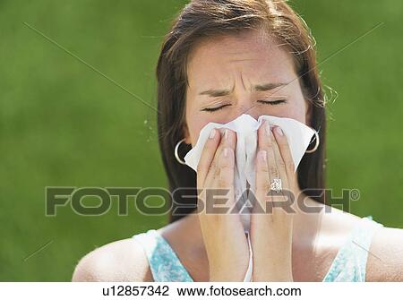 Woman blowing nose View Large Photo Image Stock Image - Woman blowing nose. Fotosearch