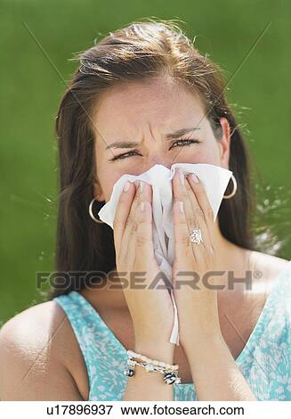 Woman blowing nose View Large Photo Image Stock Photo - Woman blowing nose. Fotosearch