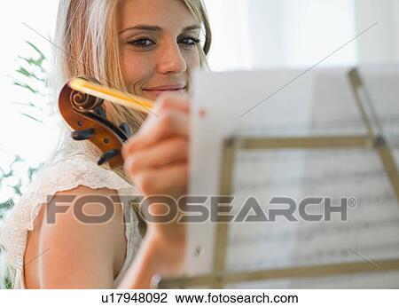 Woman composing music View Large Photo Image Stock Image - Woman composing music. Fotosearch