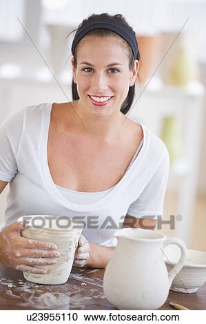 Woman making pottery View Large Photo Image Stock Image - Woman making pottery. Fotosearch
