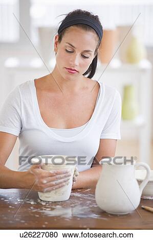 Woman making pottery View Large Photo Image Stock Image - Woman making pottery. Fotosearch