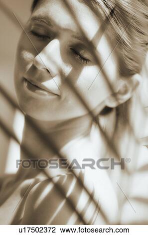 Woman relaxing in shadows View Large Photo Image Stock Image - Woman relaxing in shadows. Fotosearch