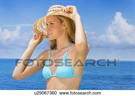Woman wearing bikini by sea View Large Photo Image Stock Image - Woman wearing bikini by sea. Fotosearch