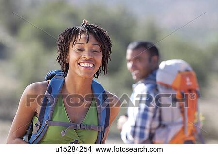 Picture - Young couple hiking and enjoying desert scenery. Fotosearch