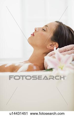 Young woman taking bath View Large Photo Image Stock Image - Young woman taking bath. Fotosearch