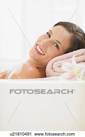 Young woman taking bath View Large Photo Image Stock Image - Young woman taking bath. Fotosearch