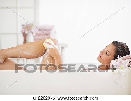 Young woman taking bath View Large Photo Image Stock Photography - Young woman taking bath. Fotosearch