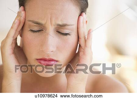 Young woman with head in hands View Large Photo Image Picture - Young woman with head in hands. Fotosearch