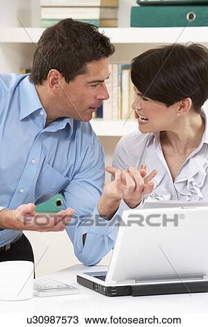 Arguing Couple Working From Home Using Laptop View Large Photo Image Stock Image - Arguing Couple Working From Home Using Laptop. Fotosearch