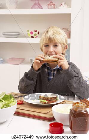 Stock Photo - Boy Making Sandwich In Kitchen. Fotosearch