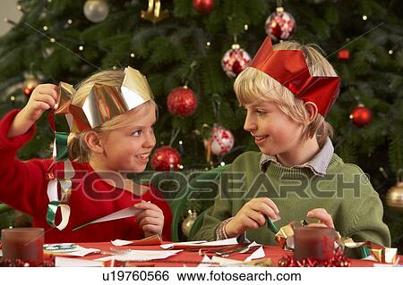 Stock Photograph - Children Making Christmas Decorations Together. Fotosearch