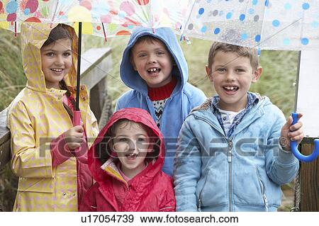 Children posing with umbrella View Large Photo Image Stock Photo - Children posing with umbrella. Fotosearch