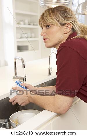 Cleaner Working In Domestic Kitchen View Large Photo Image Stock Image - Cleaner Working In Domestic Kitchen. Fotosearch