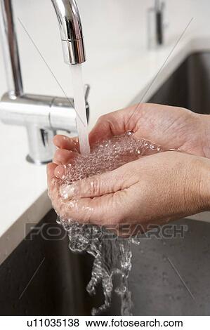 Close Up Of Woman Washing Hands At Kitchen Sink View Large Photo Image Stock Photo - Close Up Of Woman Washing Hands At Kitchen Sink. Fotosearch