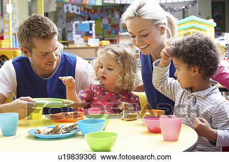 Stock Photograph - Couple and children playing with toys. Fotosearch