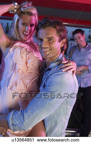 Couple Having Fun In Busy Bar View Large Photo Image Stock Image - Couple Having Fun In Busy Bar. Fotosearch